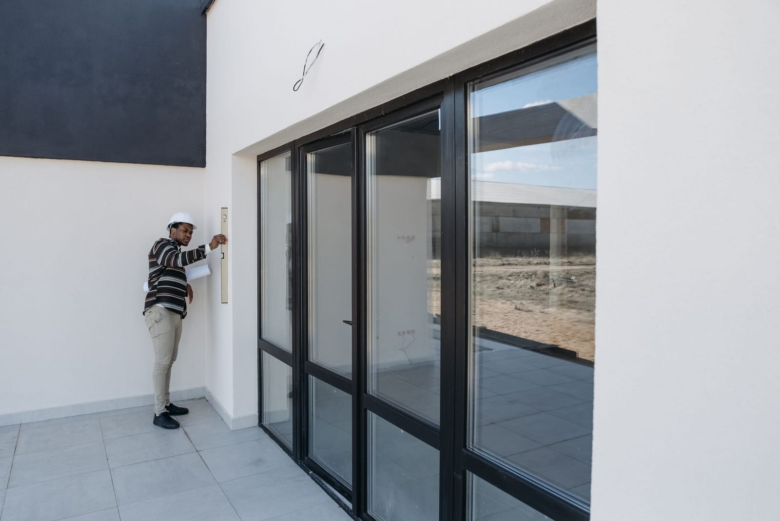 An energy assessor inspecting a property's windows and fabric during an EPC survey